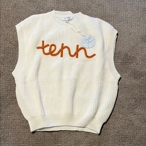 White Sleeveless Sweater with Orange Text